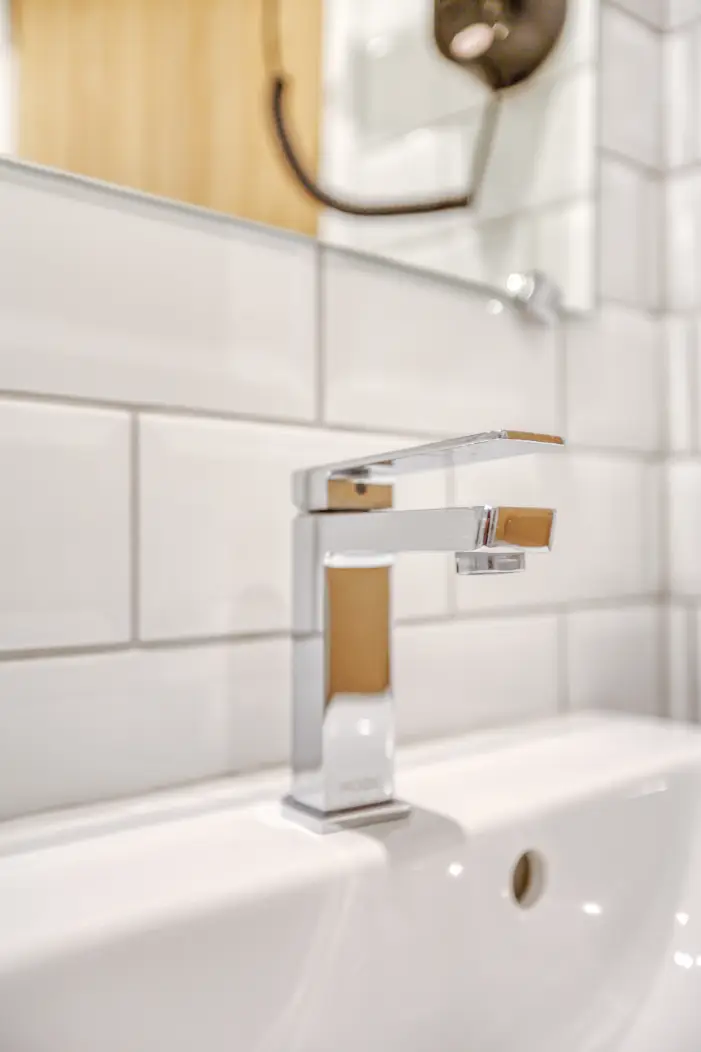 Chrome bathroom tap on a white basin